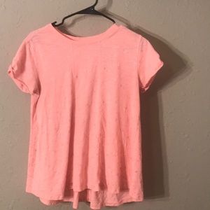 A dark coral shirt with stars on it